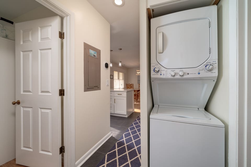 The laundry closet is off the master bedroom.  It features a stacked washer and dryer.