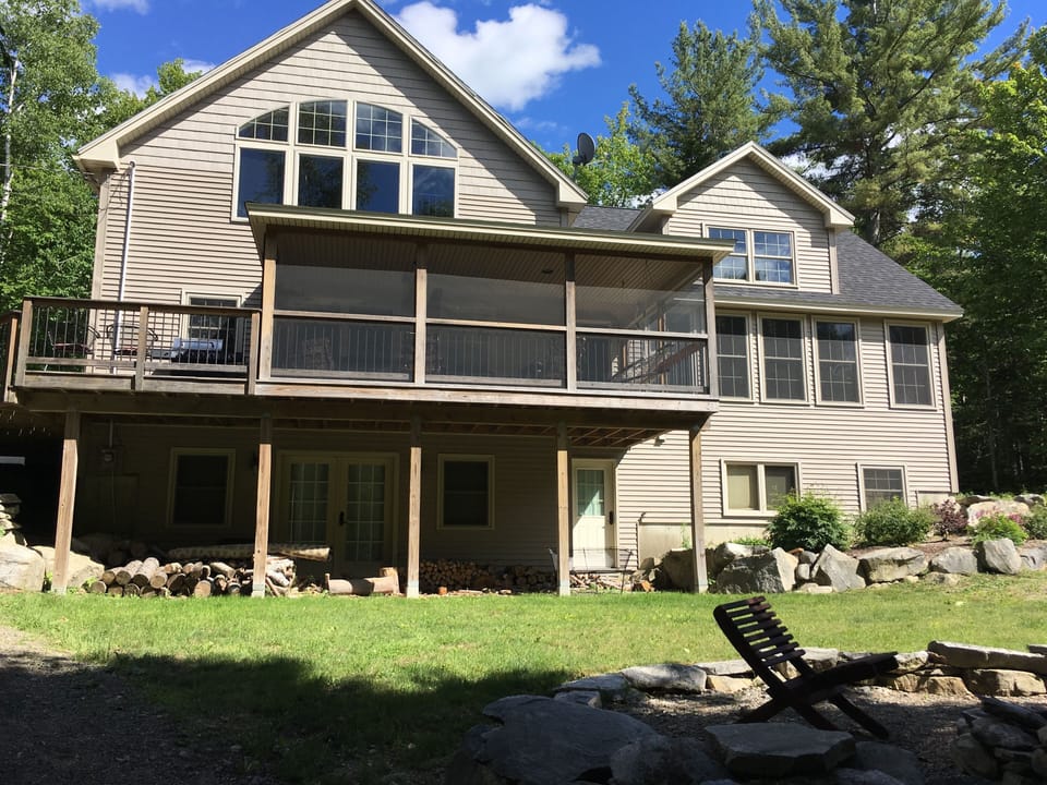 Front of the house facing the lake and yard.