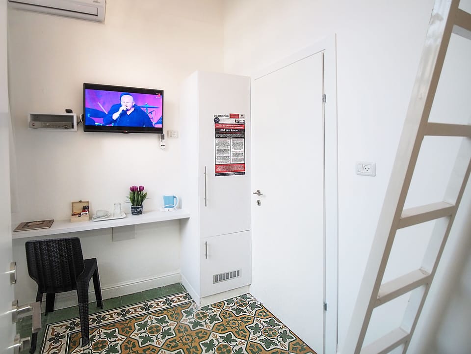Economy Studio, 1 Twin Bed | Minibar, in-room safe, individually decorated, individually furnished
