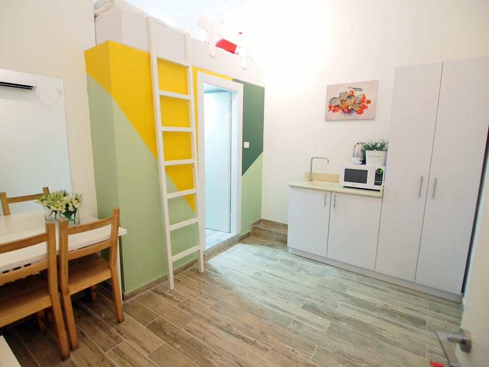 Economy Double Room, No Windows | Living area | Flat-screen TV
