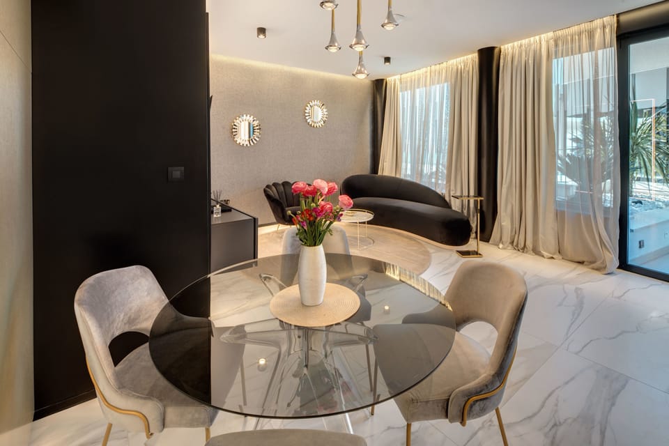 Superior Suite, Partial Sea View | Living room | Flat-screen TV