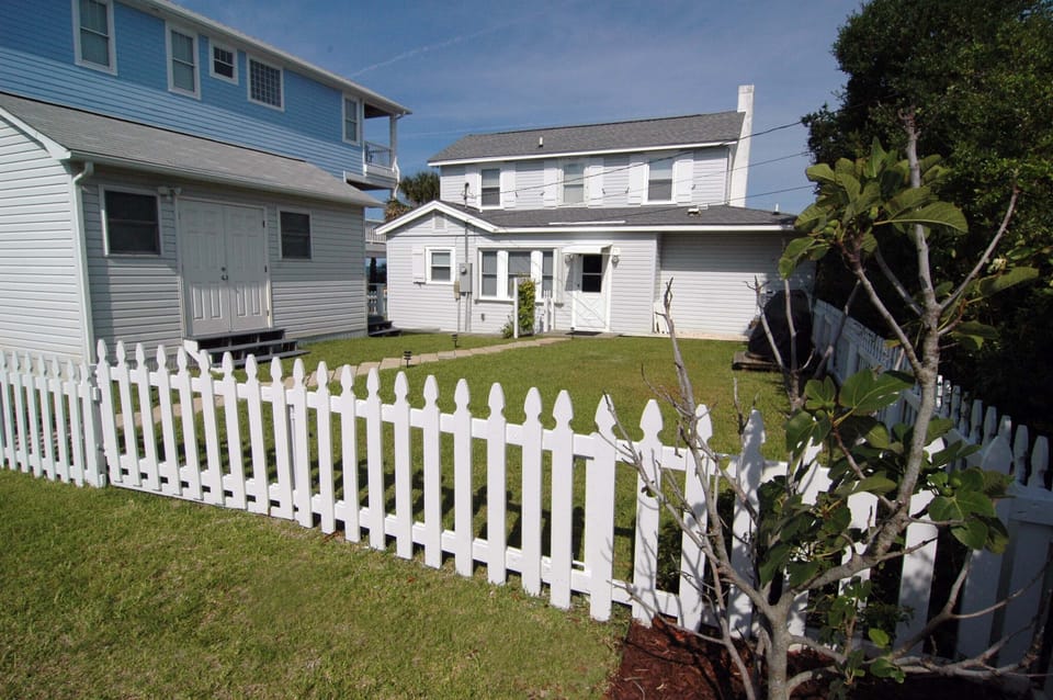 Charming fenced in back yard offers lots of privacy and an extra lot for parking