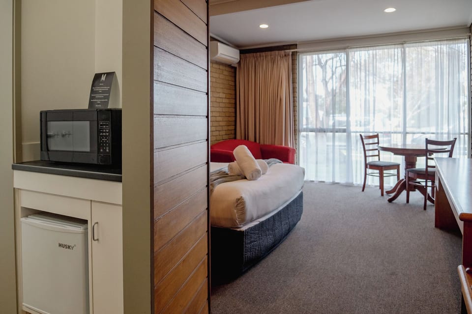Queen Room | Living area | 32-inch TV with cable channels