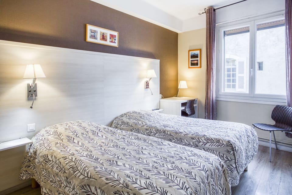 Twin Room | Individually decorated, individually furnished, desk, blackout drapes