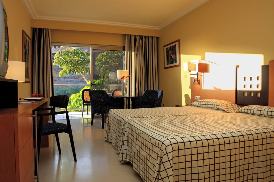 Standard Double Room, Garden View (Aquapark Access) | Minibar, in-room safe, desk, blackout drapes