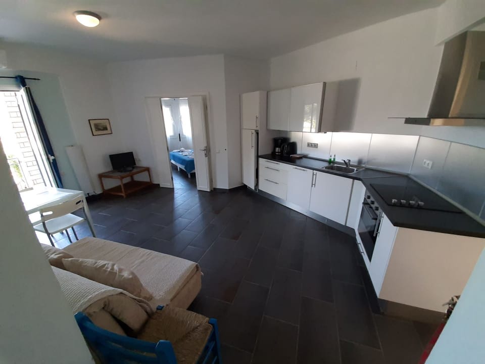 Superior Apartment, 2 Bedrooms, Sea View | Private kitchen | Full-size fridge, stovetop, coffee/tea maker, electric kettle