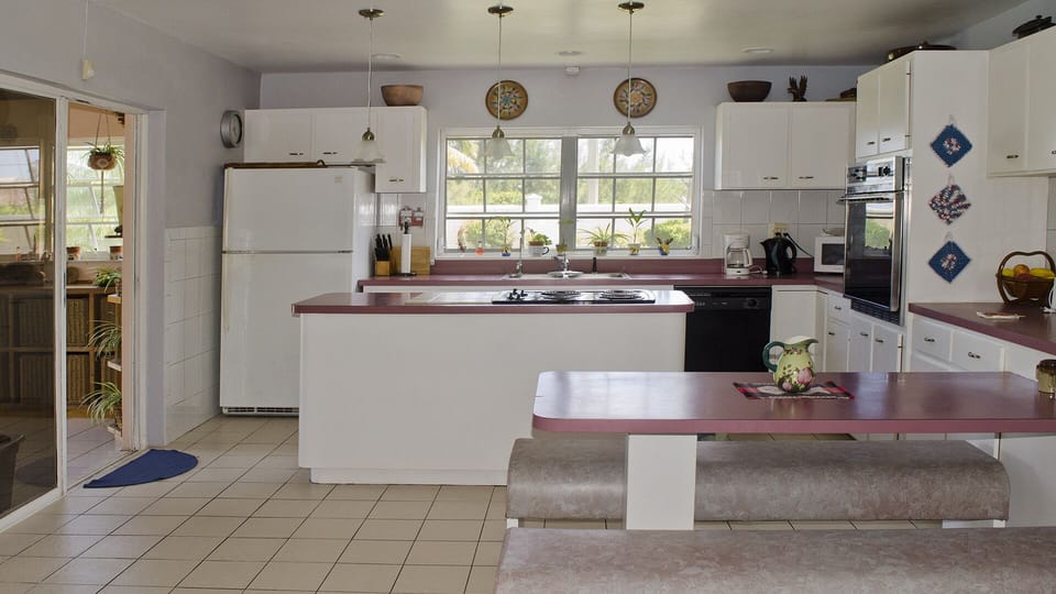 The kitchen opens up to the spacious living room.