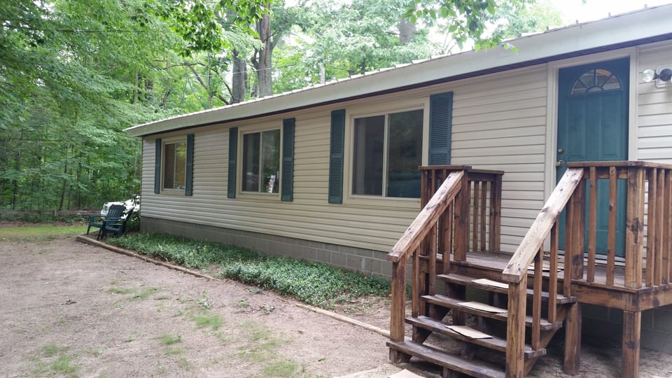 Front of cottage;  Shady, sandy and private.