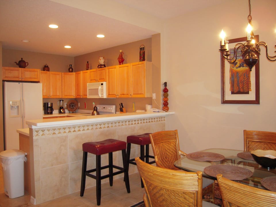 Breakfast Area with Leather Stools/Modern Well Appointed Kitchen