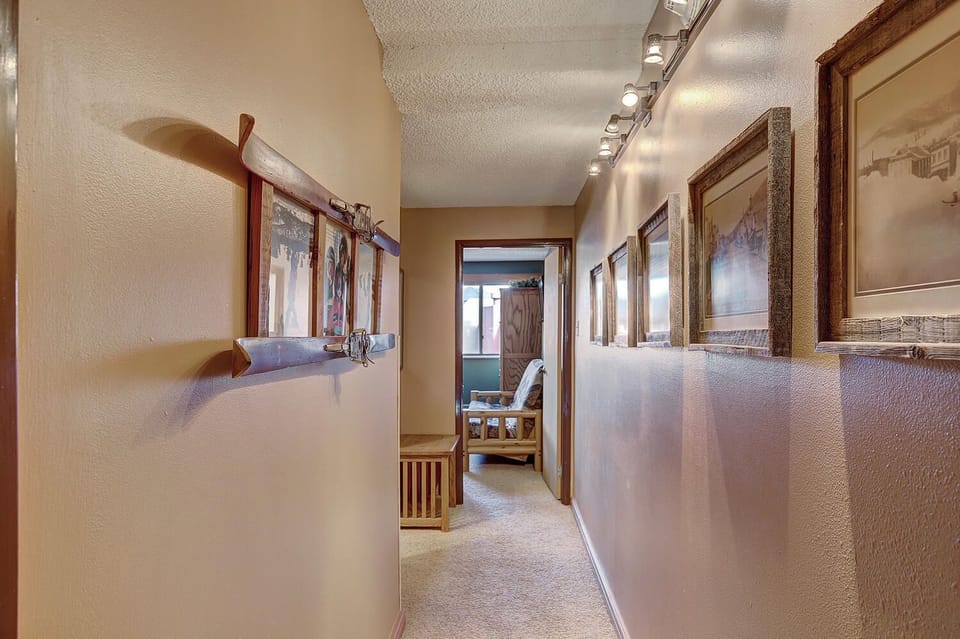 Upstairs Hallway between Bedrooms with historic Breckenridge photos