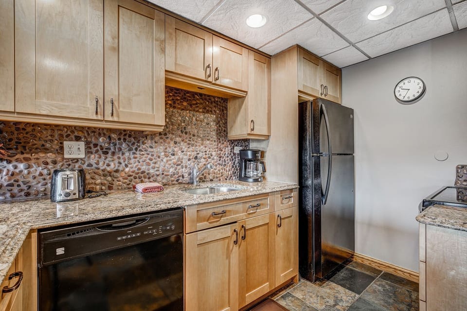 Kitchen with dishwasher, toaster, coffee pot
