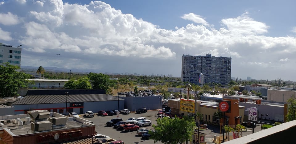 EAST VIEW OF STREET  FROM BALCONY
