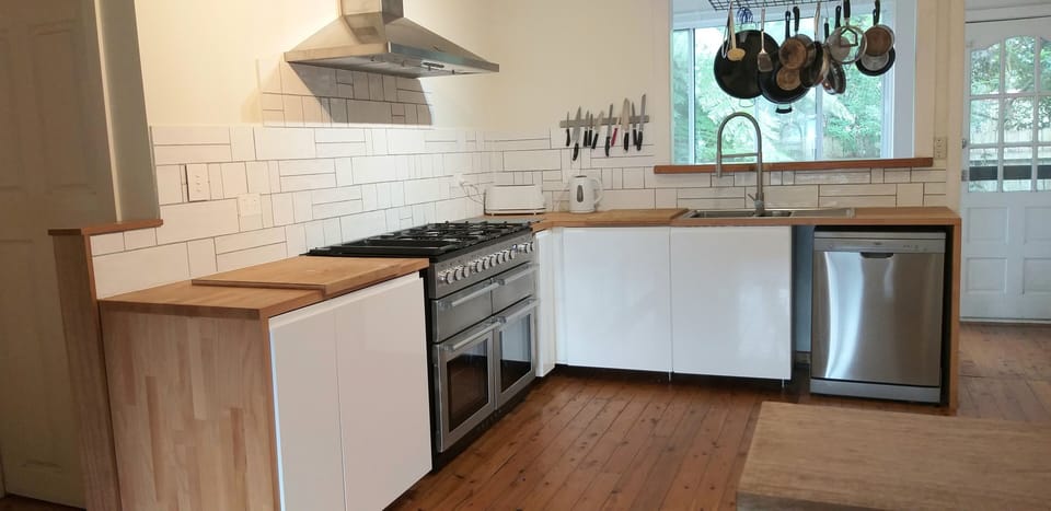 New kitchen, gas cooker with side by side electric ovens, dishwasher