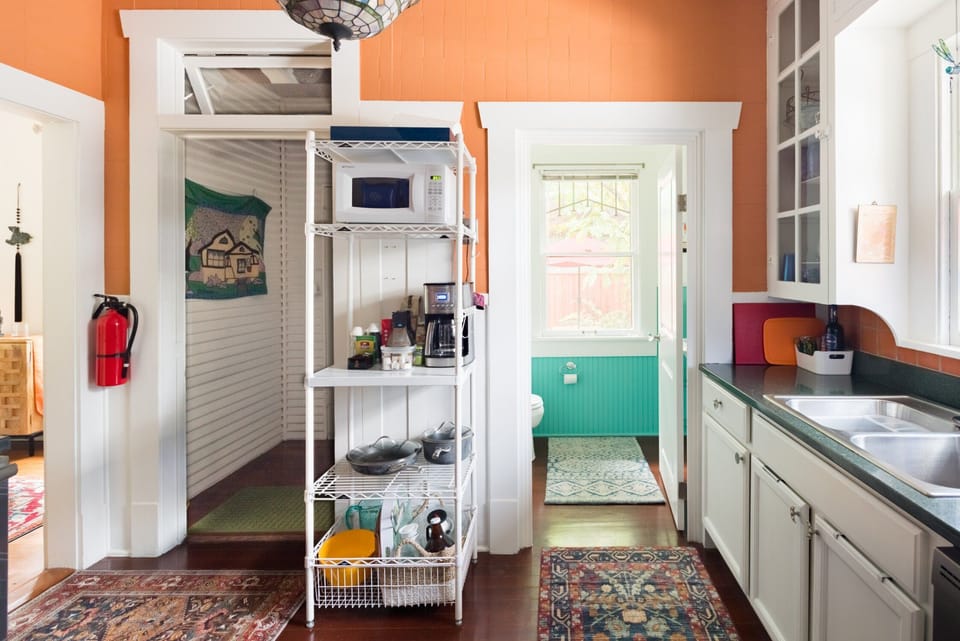 The half bath is off of the kitchen  -the back door to the courtyard is here. 