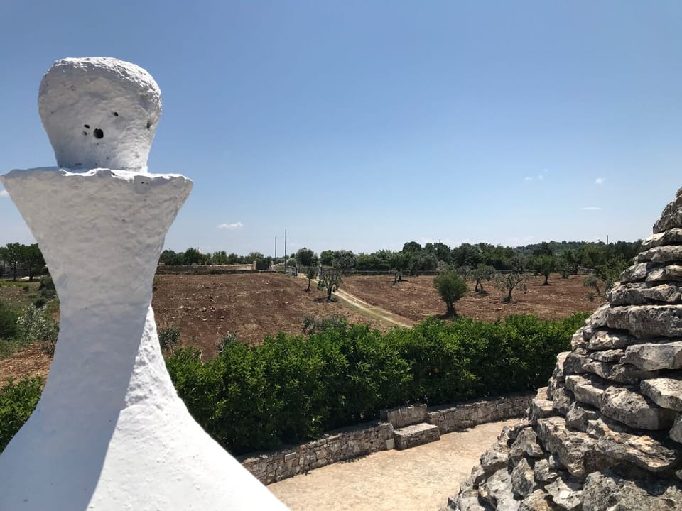 View of the front patio and driveway from the top of the Trullo.