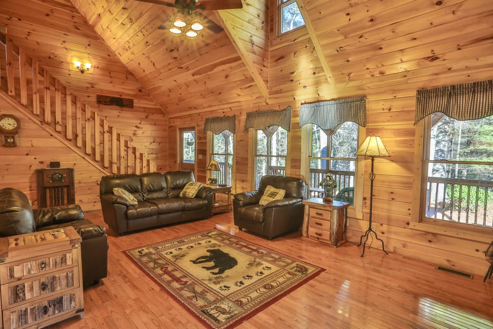 Open concept great room with comfy leather seating to accommodate the whole gang