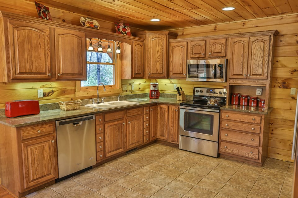 Spacious, open concept kitchen with stainless steel appliances