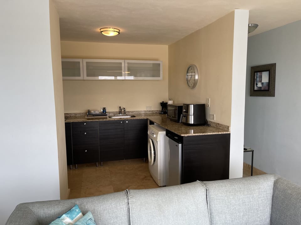 Kitchen with washing machine too! Drying racks in the closet! 