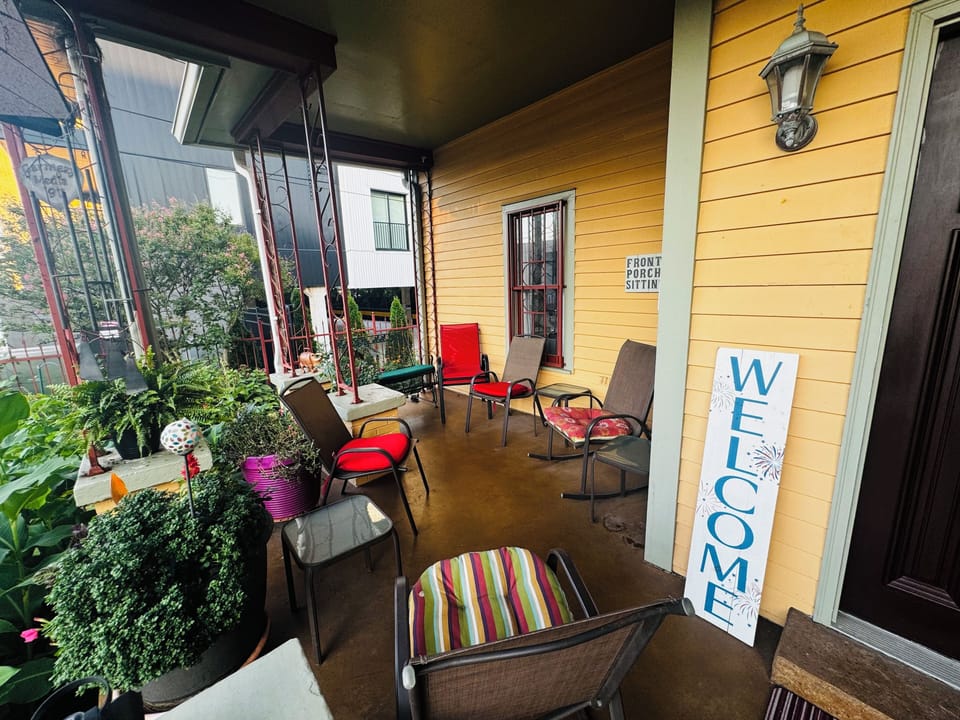 Front porch chill and watch the world go by whilst surrounded by a beauty garden