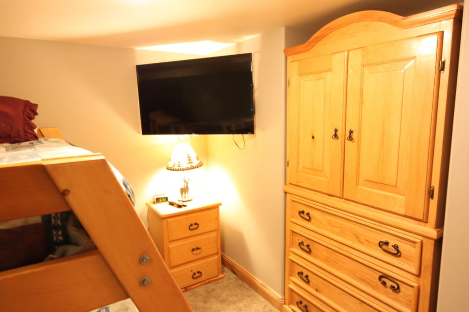 Bedroom 4 with 50 inch Smart TV and  built in closet and dresser