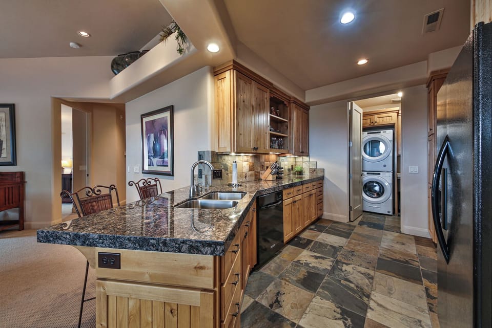 Large Kitchen With Laundry Room Off Garage Entryway