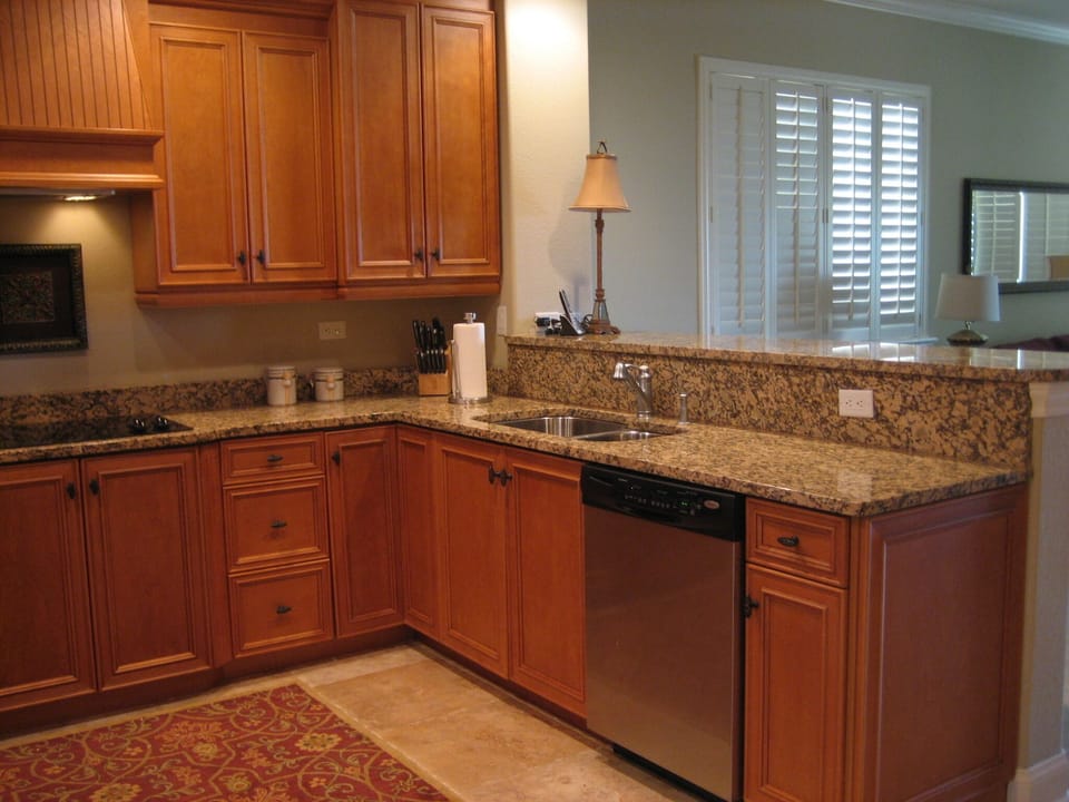 The kitchen is stocked with pots and pans, plates, utensils, and appliances.