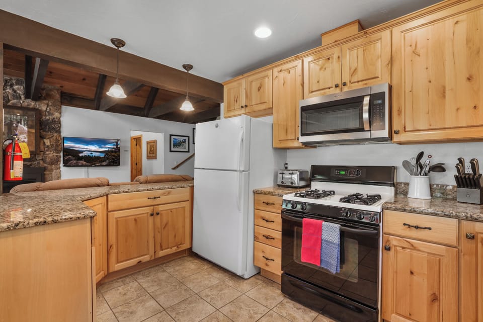The kitchen amenities and rustic charm are where meals and memories are made. 