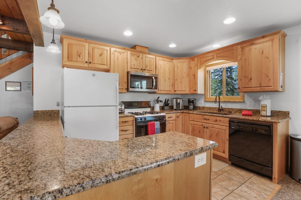 Whip up your favorite dishes surrounded by the gleam of granite countertops.
