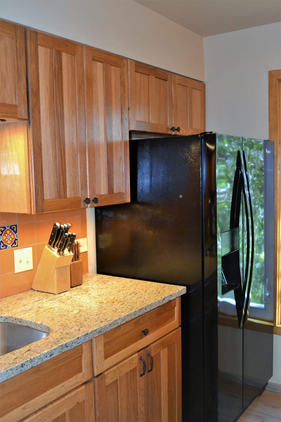 Kitchen has full size refrigerator