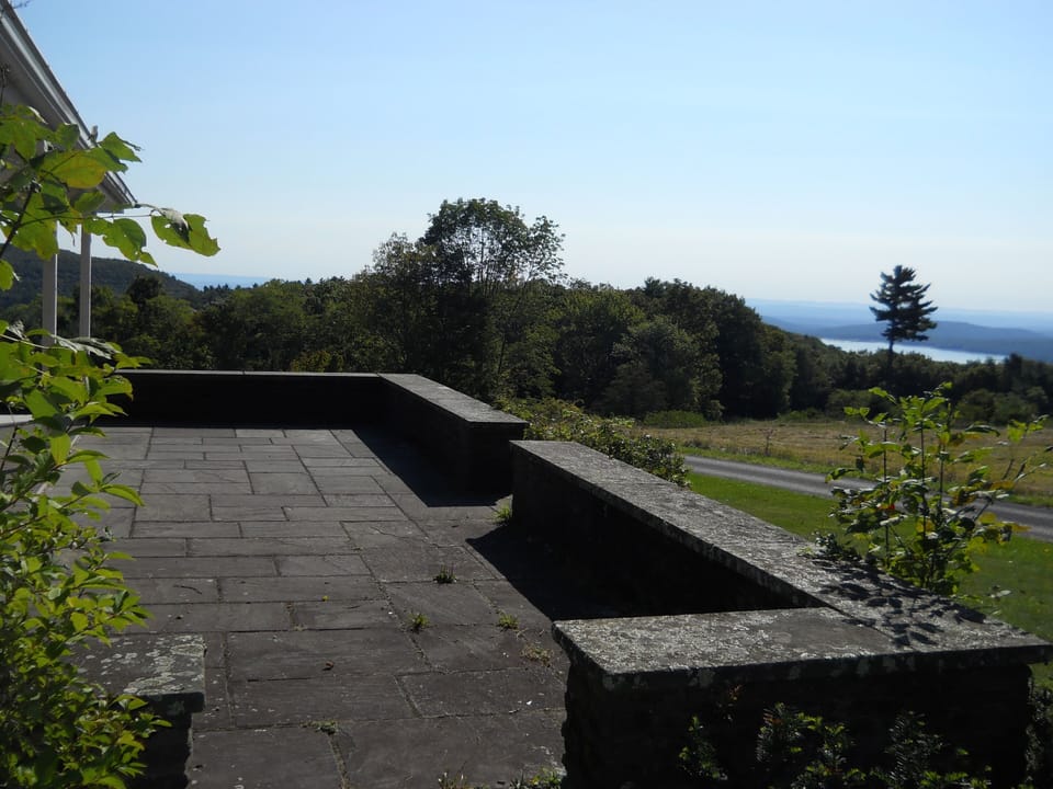 Stone patio provides stunning views, a great hang out spot with hammock, chairs.