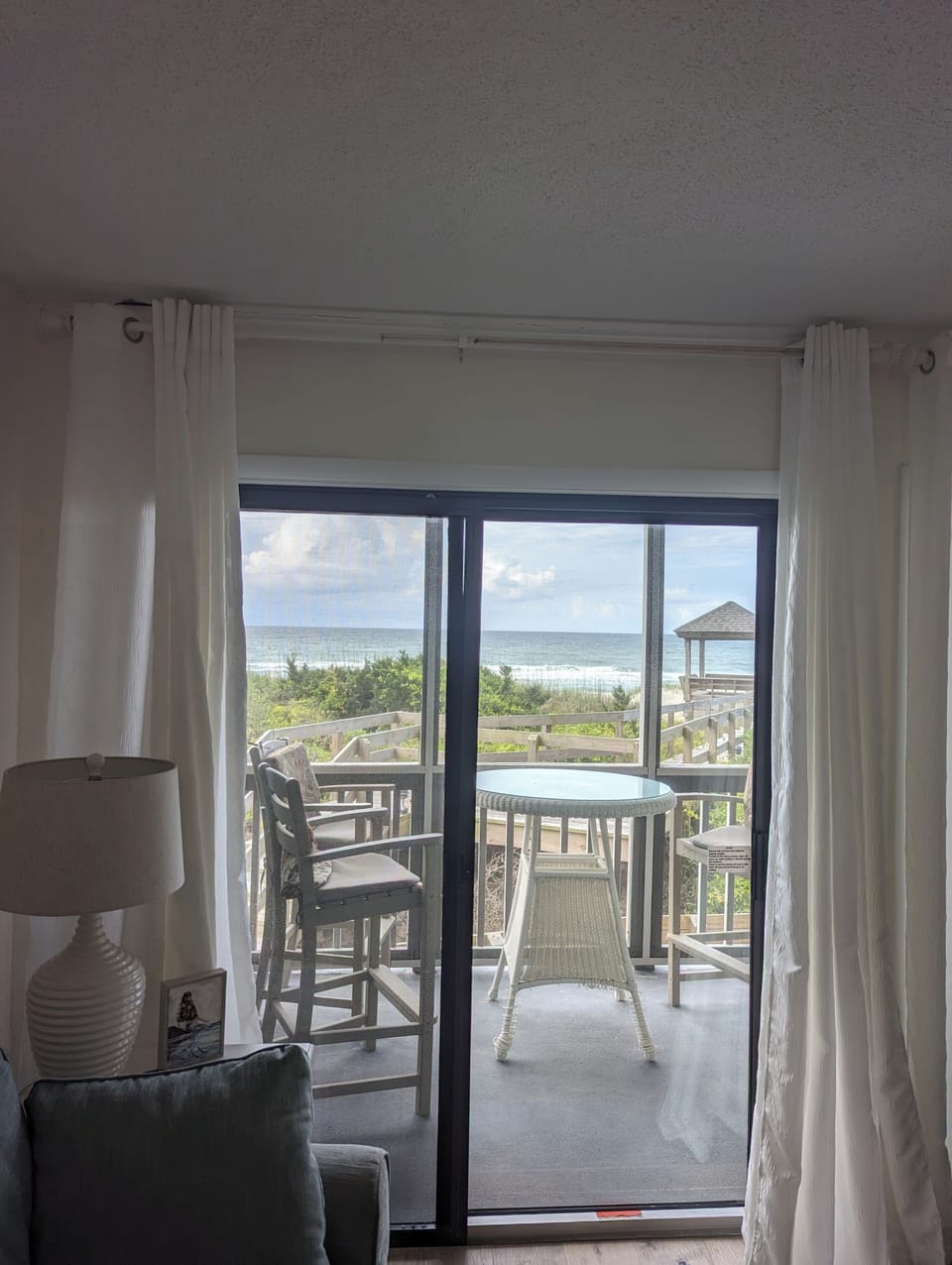 Living room view out to beach walk and the ocean