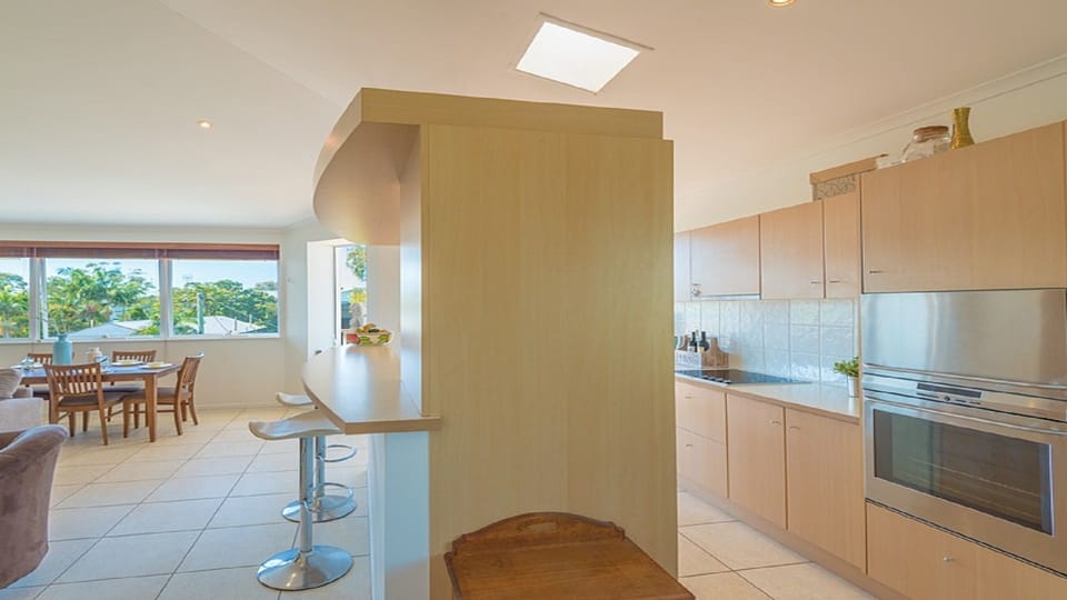 The kitchen is functional & well-equipped including a dishwasher & large fridge