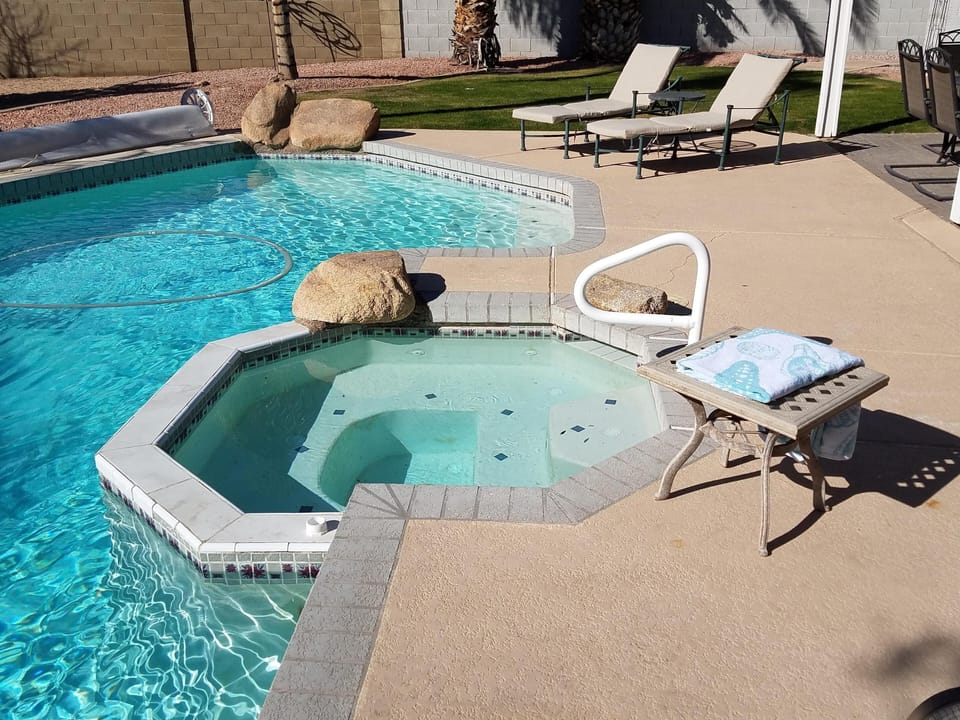 In-ground spa, attached to pool.