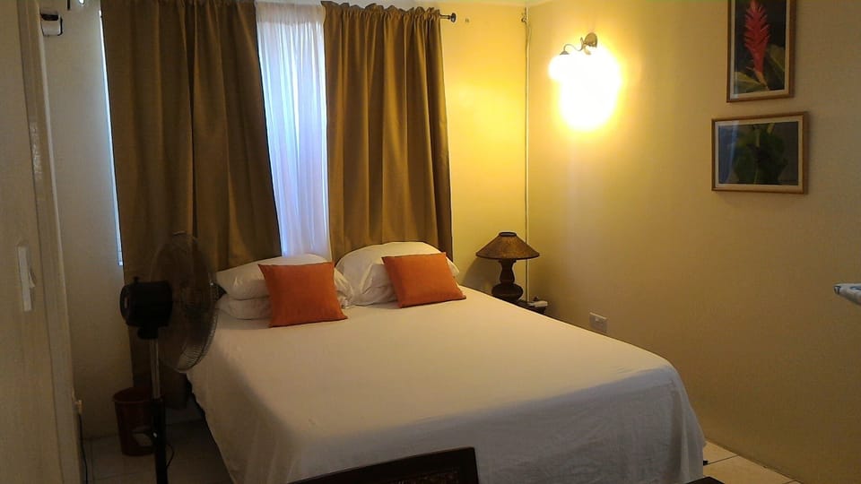 Bedroom with comfortable Queen bed and work desk