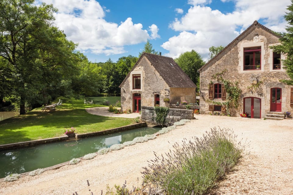 Private stone bridge crossing the river to your secluded gîte and woodland walks