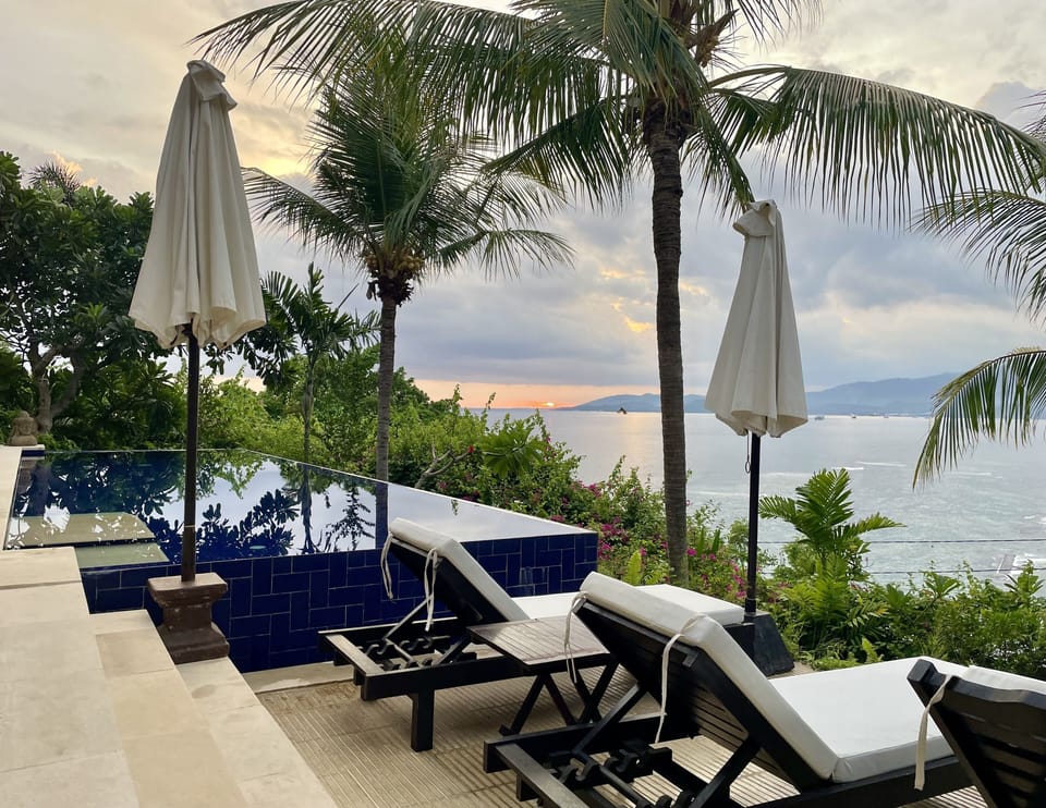 Infinity pool with sunbeds