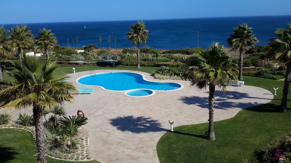 pool and ocean view from apartment terrace