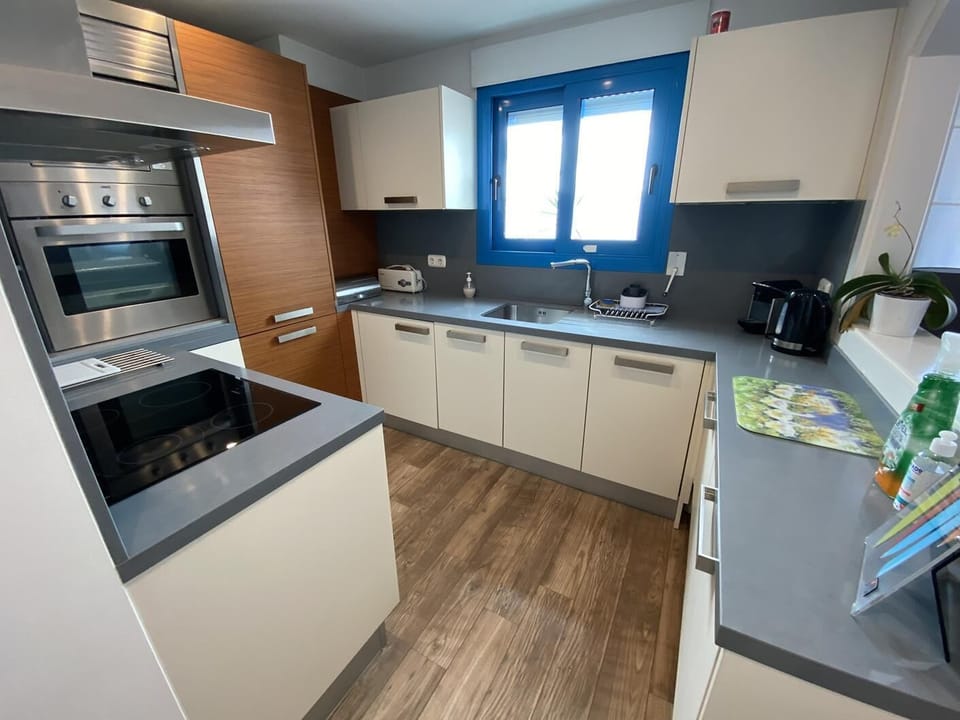 Nespresso coffee maker, toaster, kettle, storageroom with a safe and iron board