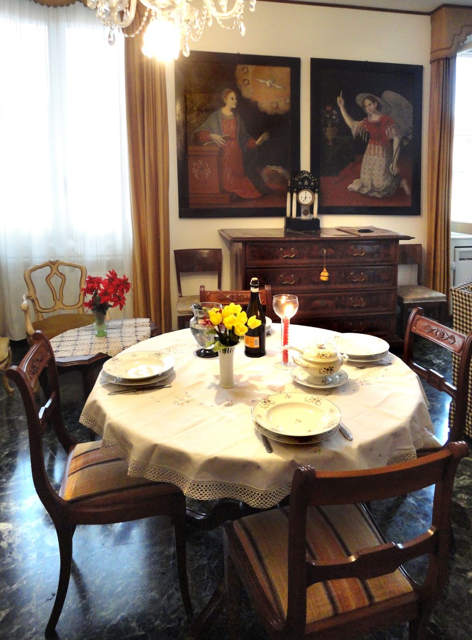 The dining area with the two large canvases between the main windows