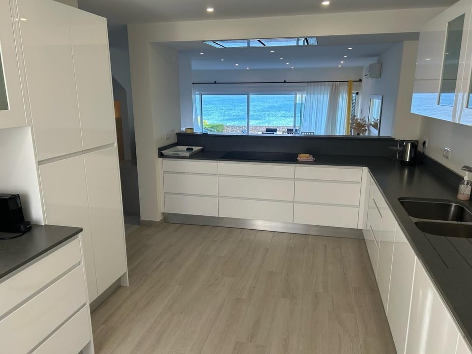 Kitchen with view to sea.  Not in view: Large fridge/freezer, oven, microwave