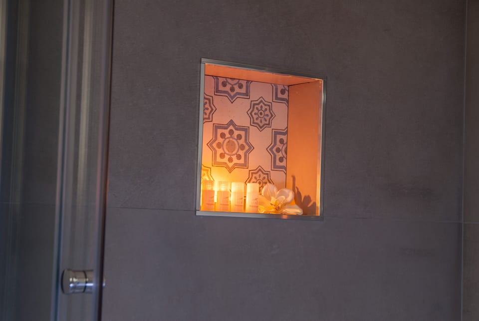 bathroom , shower , detail of space dedicated to shampoo and shower gel