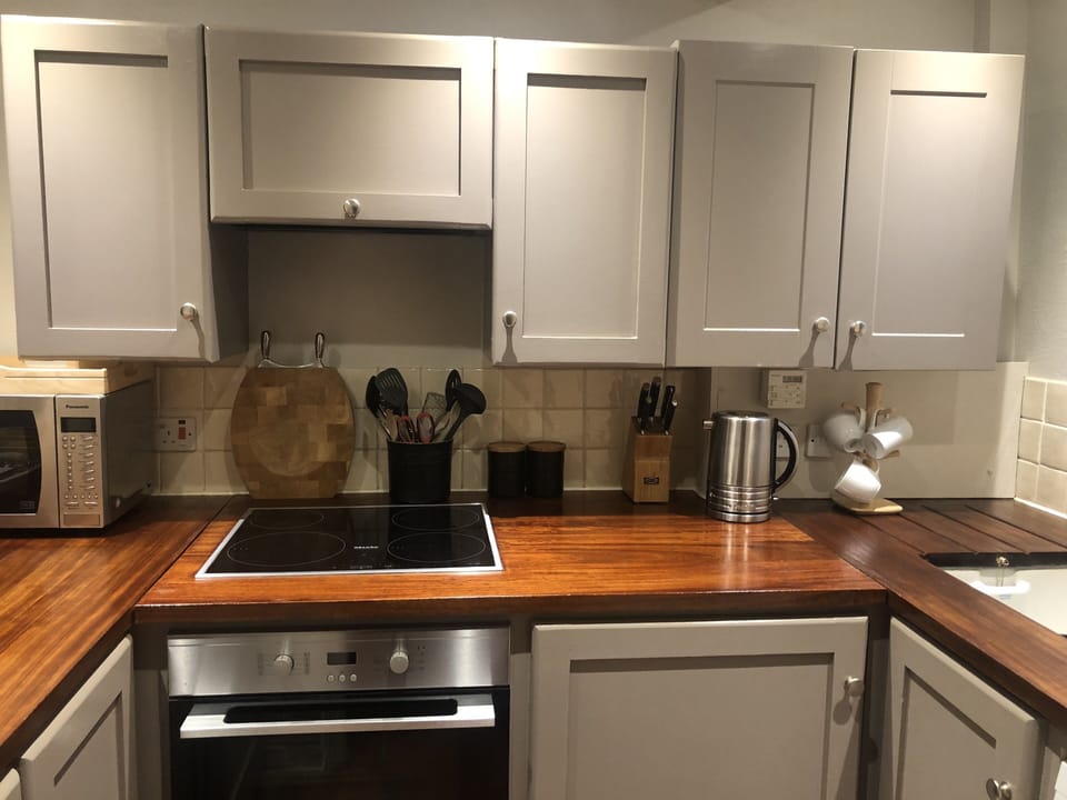  Miele oven and Hob. Lots of extra cupboard space in dining room dresser. 