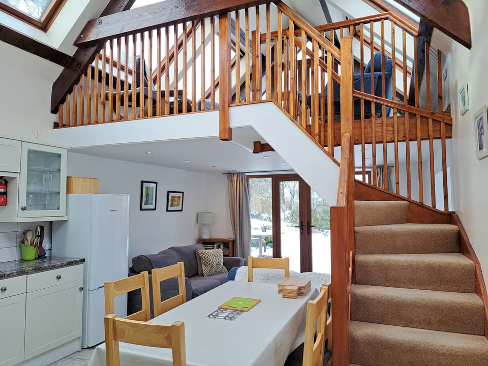 Kitchen diner with stairs to mezzanine lounge