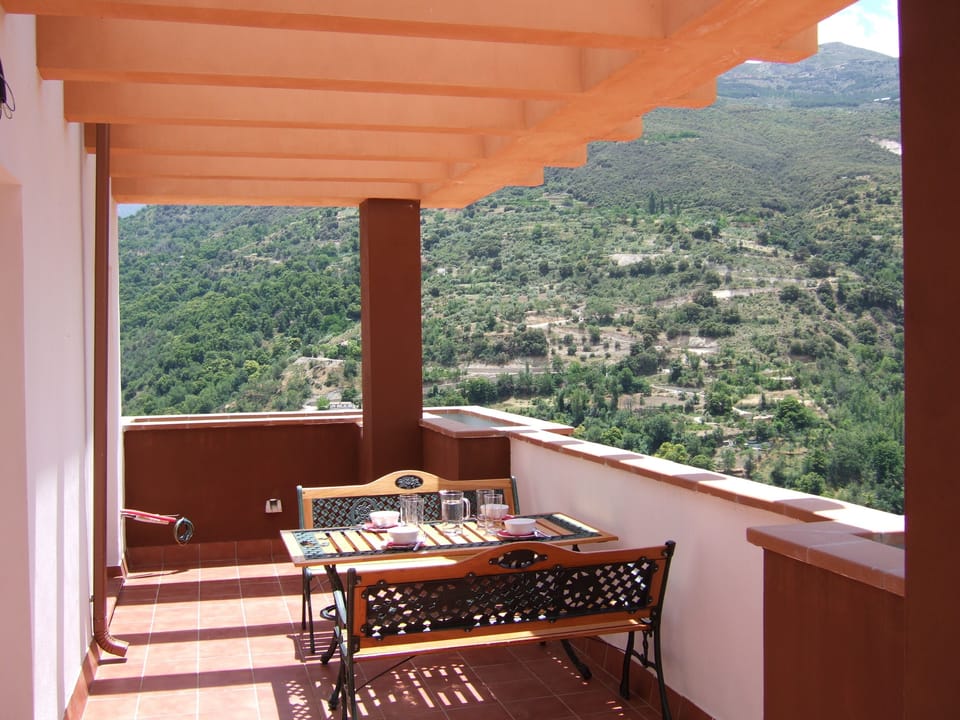 Corner of the large terrace with wraparound stunning mountain and lake views 
