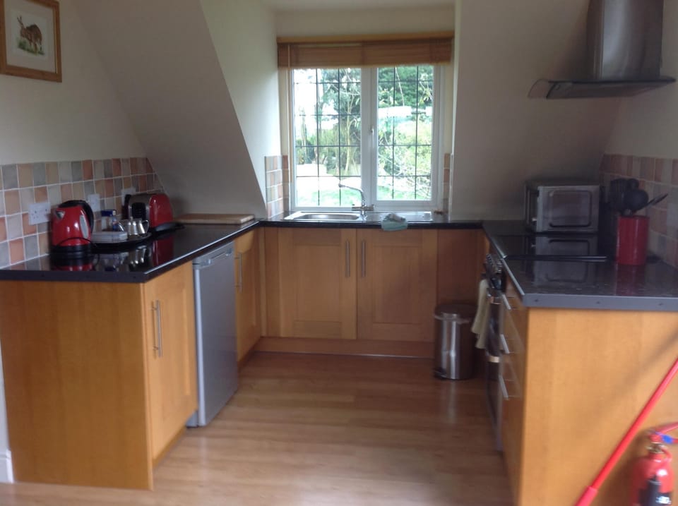 Fully equipped kitchen with a nice view over the fields