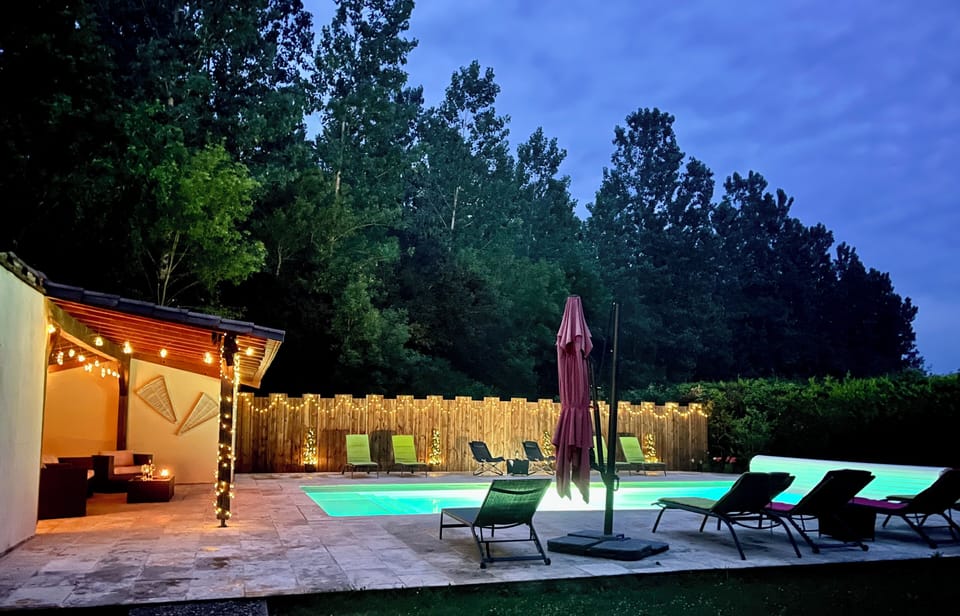 Lovely atmosphere at night with lights by the pool