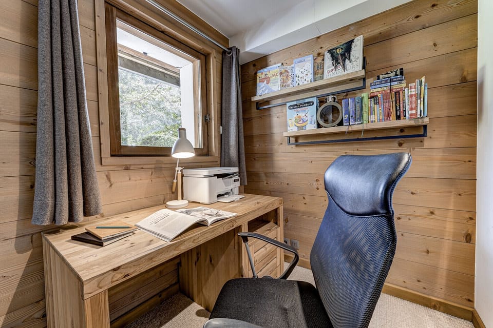 Office off TV room provides an independent work space   