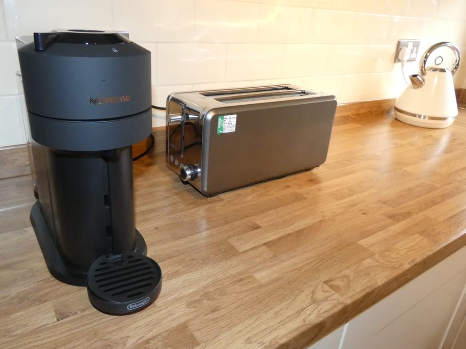 Nespresso machine, toaster and kettle.