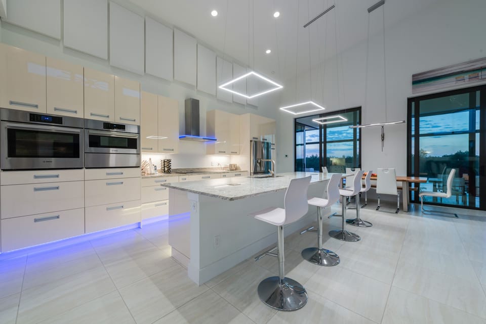 View to the modern kitchen in high-gloss finish