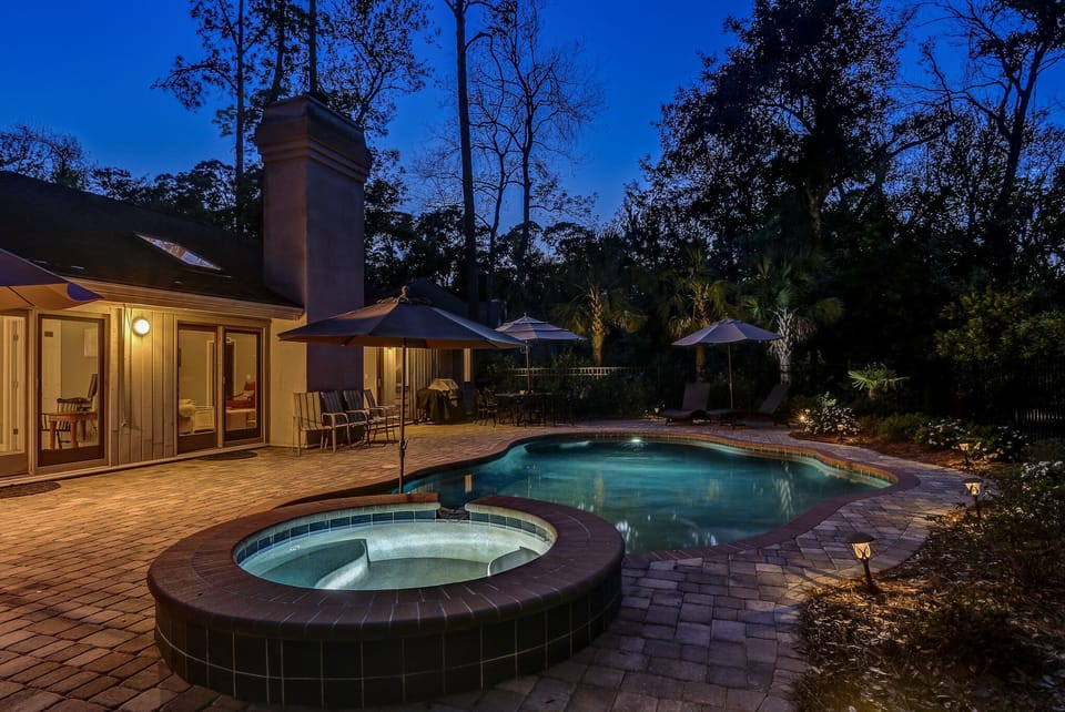 Private swimming pool at night.